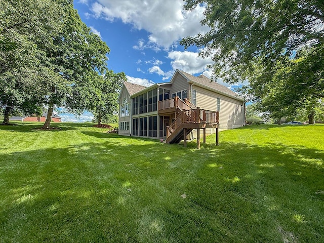 2409 Wild Oak Ct, Columbia, MO 65201 - rear view of house featuring a sunroom, stairs, a lawn, and a deck