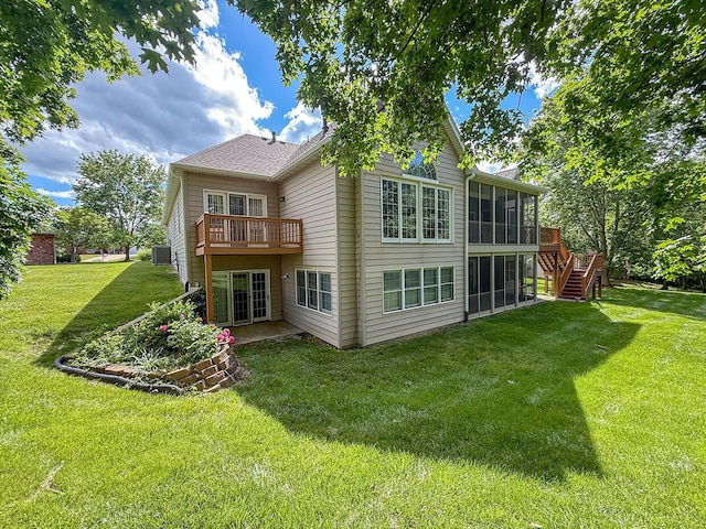 2409 Wild Oak Ct, Columbia, MO 65201 - back of house featuring a sunroom, a wooden deck, stairs, and a yard