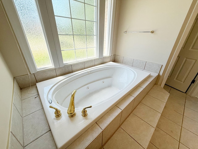 2409 Wild Oak Ct, Columbia, MO 65201 - bathroom with plenty of natural light, a whirlpool tub, and tile patterned floors
