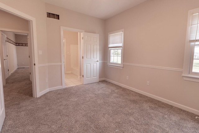 2409 Wild Oak Ct, Columbia, MO 65201 - unfurnished bedroom featuring carpet flooring and baseboards