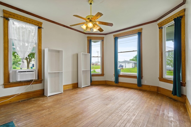 408 Vassar St, Bunceton, MO 65237 - spare room with hardwood / wood-style floors, crown molding, a ceiling fan, and cooling unit