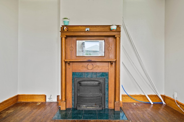 408 Vassar St, Bunceton, MO 65237 - detailed view of wood finished floors and a tiled fireplace