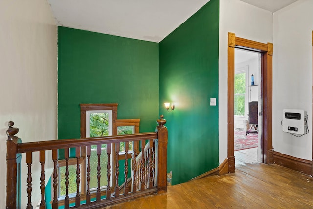 408 Vassar St, Bunceton, MO 65237 - corridor featuring an upstairs landing, hardwood / wood-style flooring, and heating unit