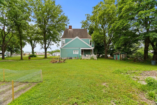 408 Vassar St, Bunceton, MO 65237 - view of green lawn with a storage shed