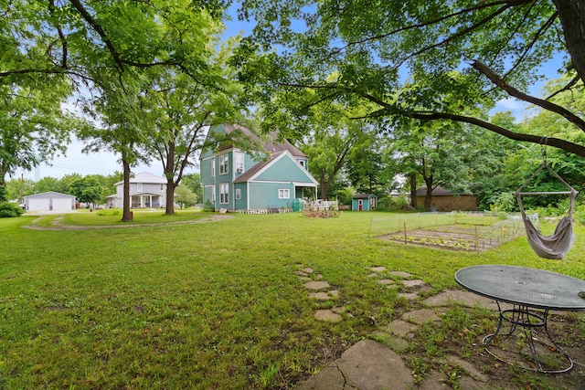 408 Vassar St, Bunceton, MO 65237 - view of green lawn featuring an outbuilding