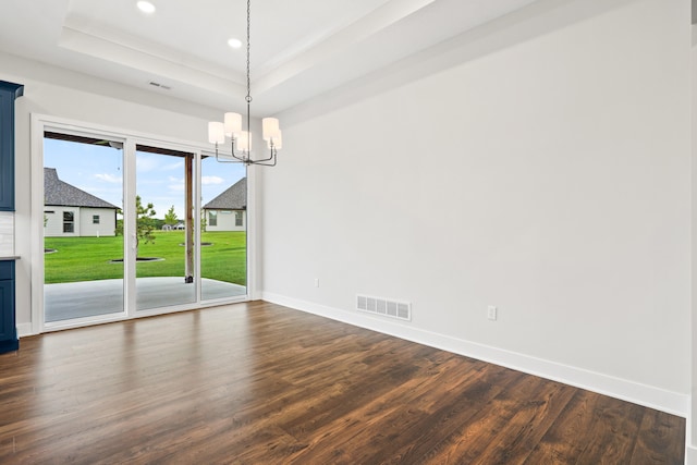 6505 Cromford Ln, Columbia, MO 65201 - empty room featuring a tray ceiling, baseboards, dark wood-style flooring, a chandelier, and recessed lighting