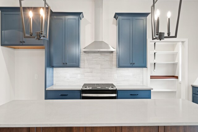 6505 Cromford Ln, Columbia, MO 65201 - kitchen featuring stainless steel electric stove, wall chimney range hood, blue cabinetry, and decorative backsplash