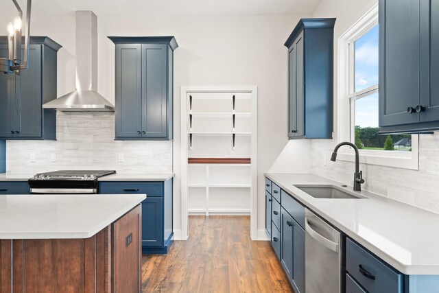6505 Cromford Ln, Columbia, MO 65201 - kitchen featuring wall chimney range hood, a sink, stainless steel appliances, wood finished floors, and light countertops