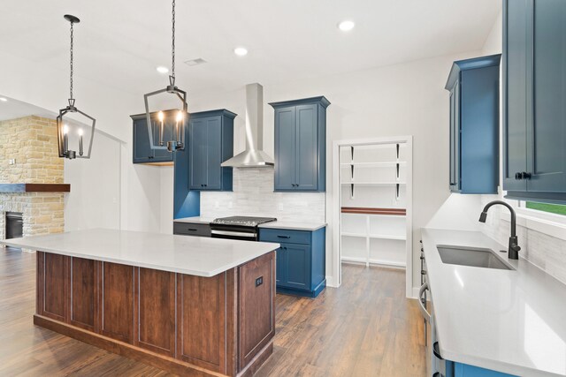 6505 Cromford Ln, Columbia, MO 65201 - kitchen with wall chimney exhaust hood, a sink, tasteful backsplash, dark wood-style flooring, and recessed lighting
