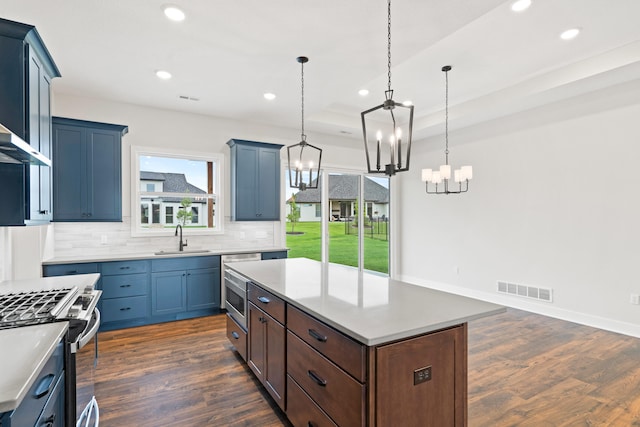 6505 Cromford Ln, Columbia, MO 65201 - kitchen with a sink, appliances with stainless steel finishes, decorative backsplash, dark wood-style flooring, and recessed lighting