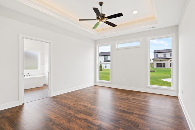 6505 Cromford Ln, Columbia, MO 65201 - unfurnished room featuring a raised ceiling, dark wood finished floors, a ceiling fan, baseboards, and recessed lighting