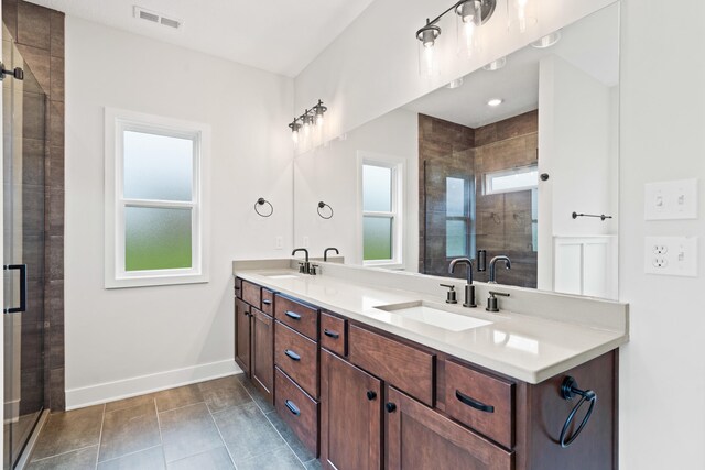 6505 Cromford Ln, Columbia, MO 65201 - full bathroom with double vanity, baseboards, a shower stall, and tile patterned floors