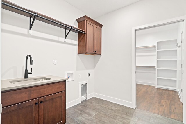 6505 Cromford Ln, Columbia, MO 65201 - laundry area featuring electric dryer hookup, hookup for a washing machine, cabinet space, and baseboards