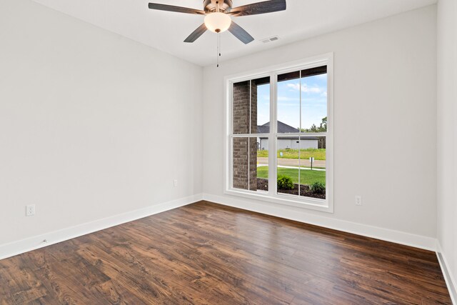 6505 Cromford Ln, Columbia, MO 65201 - spare room with dark wood-type flooring, baseboards, and a ceiling fan