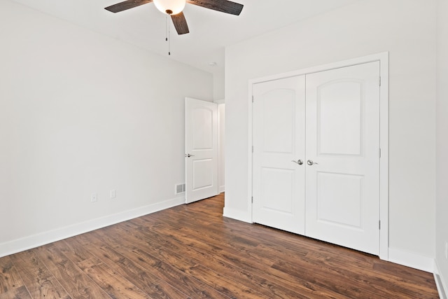 6505 Cromford Ln, Columbia, MO 65201 - unfurnished bedroom featuring dark wood finished floors, a closet, baseboards, and a ceiling fan