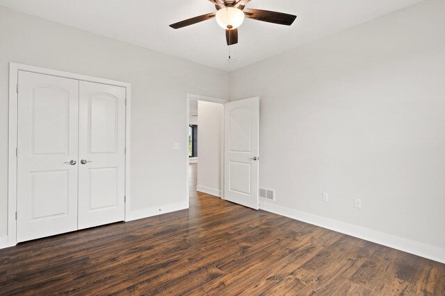 6505 Cromford Ln, Columbia, MO 65201 - unfurnished bedroom featuring dark wood finished floors, a closet, baseboards, and ceiling fan