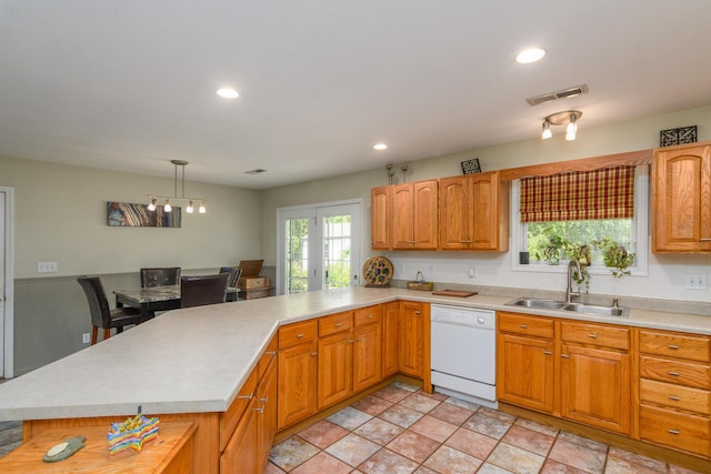 3111 E E W Snowy Hills Ln, Hartsburg, MO 65039 - kitchen with dishwasher, a sink, light countertops, a peninsula, and pendant lighting