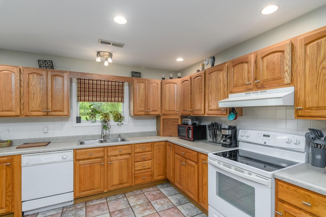 3111 E E W Snowy Hills Ln, Hartsburg, MO 65039 - kitchen featuring white appliances, under cabinet range hood, a sink, decorative backsplash, and light countertops