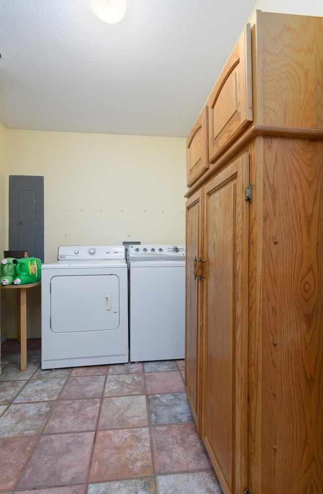 3111 E E W Snowy Hills Ln, Hartsburg, MO 65039 - washroom with electric panel, cabinet space, washing machine and clothes dryer, and stone finish floors