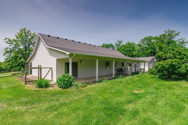 3111 E E W Snowy Hills Ln, Hartsburg, MO 65039 - rear view of house with a yard and a shingled roof