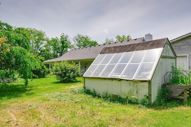3111 E E W Snowy Hills Ln, Hartsburg, MO 65039 - view of grassy yard featuring a greenhouse and an outbuilding