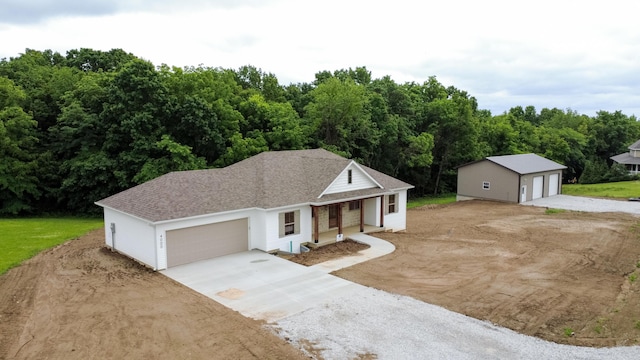 4000 S Felicity Ln, Columbia, MO 65203 - ranch-style house featuring covered porch, a shingled roof, and an outdoor structure