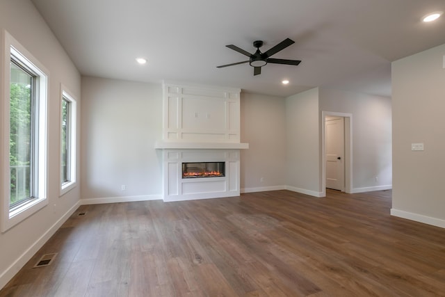 4000 S Felicity Ln, Columbia, MO 65203 - unfurnished living room with wood finished floors, ceiling fan, a large fireplace, baseboards, and recessed lighting