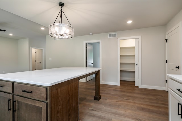 4000 S Felicity Ln, Columbia, MO 65203 - kitchen featuring dark wood finished floors, baseboards, light countertops, recessed lighting, and pendant lighting