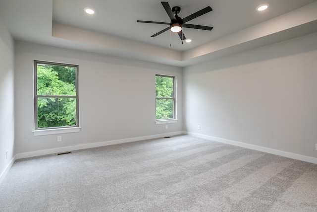 4000 S Felicity Ln, Columbia, MO 65203 - empty room featuring baseboards, a tray ceiling, a ceiling fan, recessed lighting, and carpet