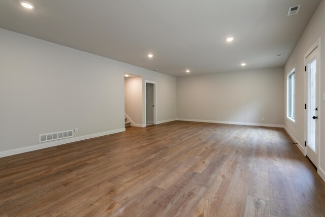 4000 S Felicity Ln, Columbia, MO 65203 - spare room featuring stairs, wood finished floors, recessed lighting, and baseboards