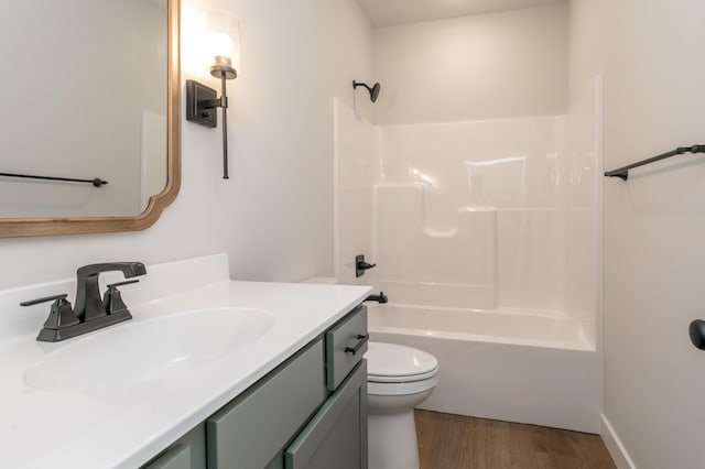 4000 S Felicity Ln, Columbia, MO 65203 - full bathroom featuring toilet, vanity, wood finished floors, and  shower combination
