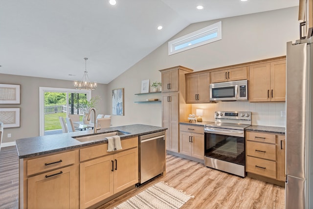 5990 W Tamarack Dr, Columbia, MO 65203 - kitchen featuring appliances with stainless steel finishes, light brown cabinetry, light wood finished floors, recessed lighting, and high vaulted ceiling