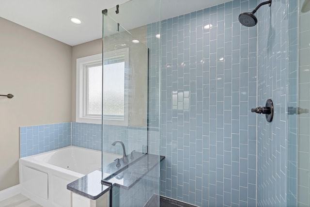 5990 W Tamarack Dr, Columbia, MO 65203 - full bathroom with a garden tub and a tile shower