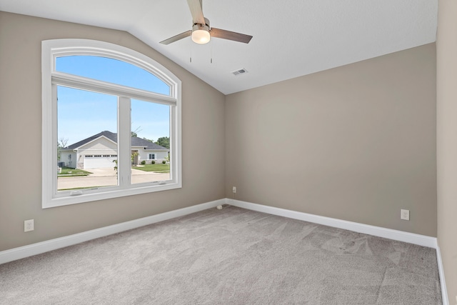 5990 W Tamarack Dr, Columbia, MO 65203 - carpeted empty room with lofted ceiling and a ceiling fan
