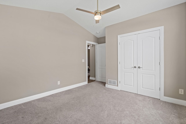 5990 W Tamarack Dr, Columbia, MO 65203 - unfurnished bedroom with vaulted ceiling, carpet, a closet, and a ceiling fan