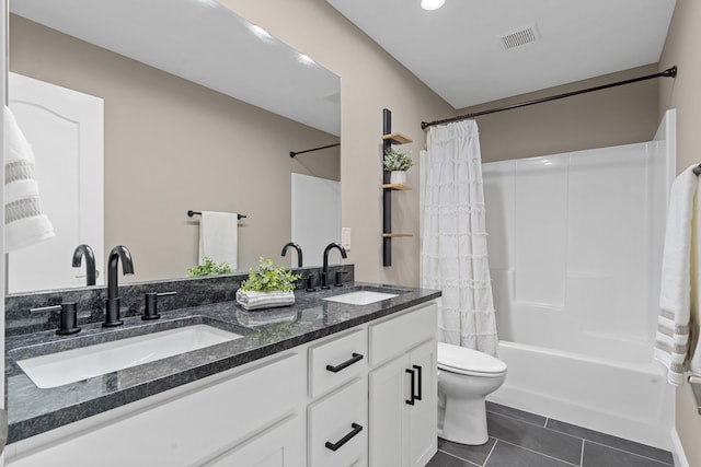 5990 W Tamarack Dr, Columbia, MO 65203 - bathroom featuring double vanity, shower / bath combo with shower curtain, tile patterned flooring, and recessed lighting
