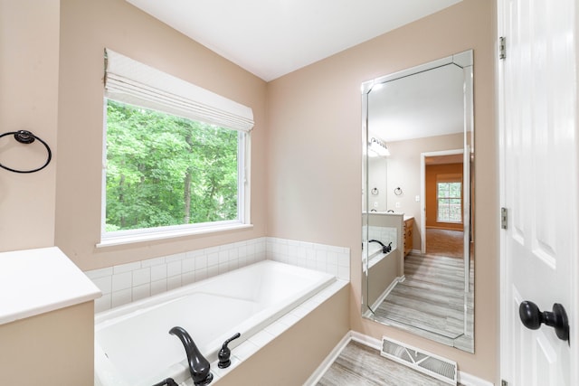 4300 E Ravens Ridge Dr, Columbia, MO 65201 - full bath featuring a garden tub, baseboards, and vanity