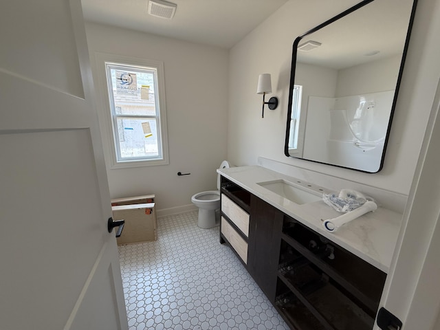 5915 Ivory Ln, Columbia, MO 65201 - bathroom featuring vanity, toilet, and baseboards