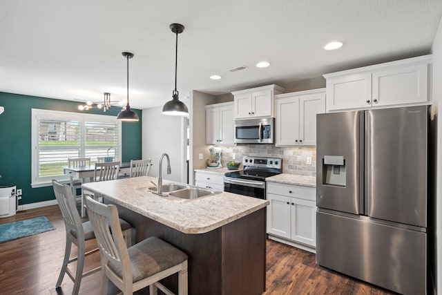 4841 Valley Forge Cir, Ashland, MO 65010 - kitchen featuring stainless steel appliances, a sink, light countertops, white cabinets, and recessed lighting