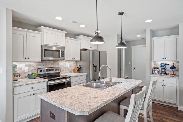 4841 Valley Forge Cir, Ashland, MO 65010 - kitchen featuring appliances with stainless steel finishes, a sink, decorative backsplash, dark wood-style floors, and recessed lighting