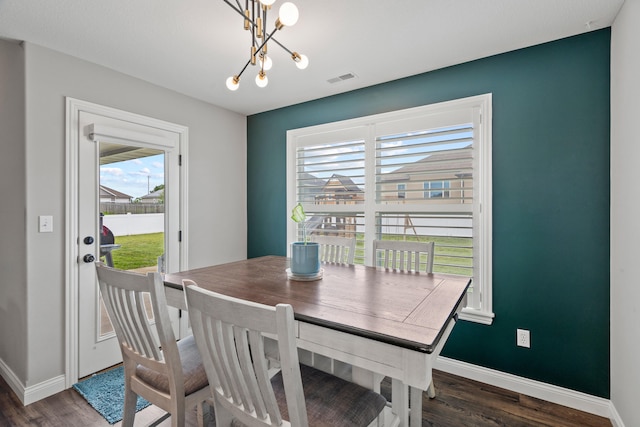 4841 Valley Forge Cir, Ashland, MO 65010 - dining space with wood finished floors, a chandelier, and baseboards