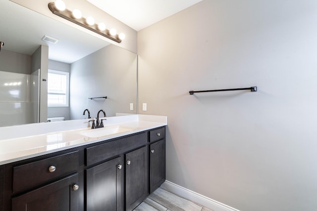 5506 Murfreesboro Dr, Columbia, MO 65201 - bathroom featuring vanity, toilet, a shower, and baseboards
