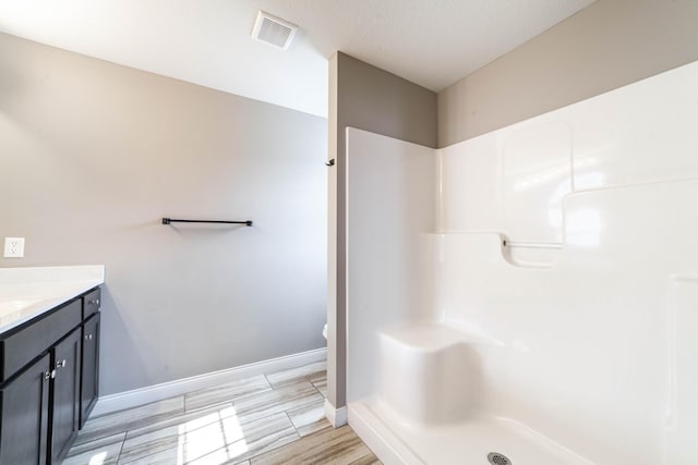 5506 Murfreesboro Dr, Columbia, MO 65201 - full bathroom featuring vanity, baseboards, a shower, and toilet