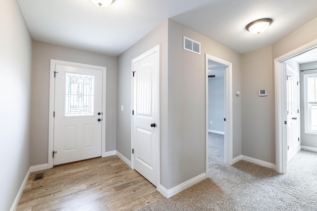 5506 Murfreesboro Dr, Columbia, MO 65201 - foyer with baseboards and light wood-type flooring