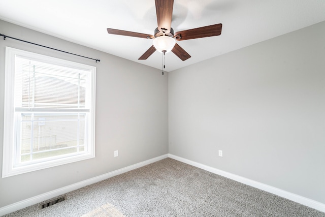 5506 Murfreesboro Dr, Columbia, MO 65201 - carpeted empty room featuring plenty of natural light, baseboards, and a ceiling fan