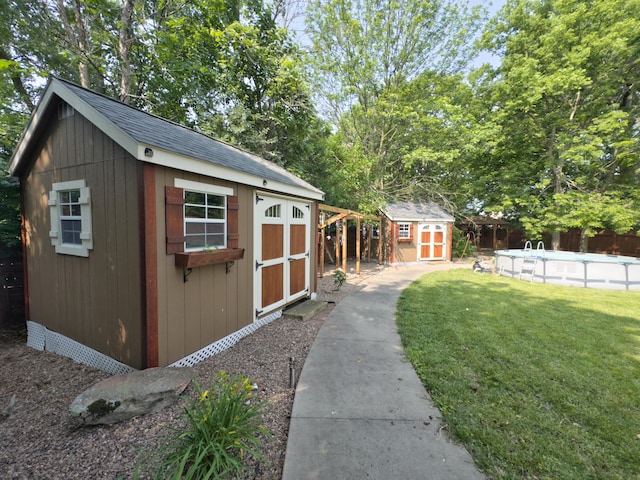 1402 Jean Rae Dr, Columbia, MO 65203 - view of shed with an outdoor pool