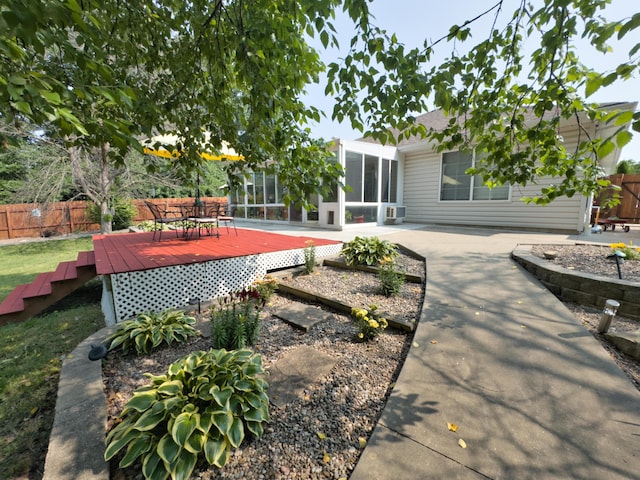 1402 Jean Rae Dr, Columbia, MO 65203 - view of yard with a sunroom and a deck
