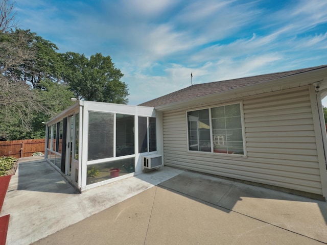 1402 Jean Rae Dr, Columbia, MO 65203 - back of house with a sunroom, a patio area, roof with shingles, and cooling unit