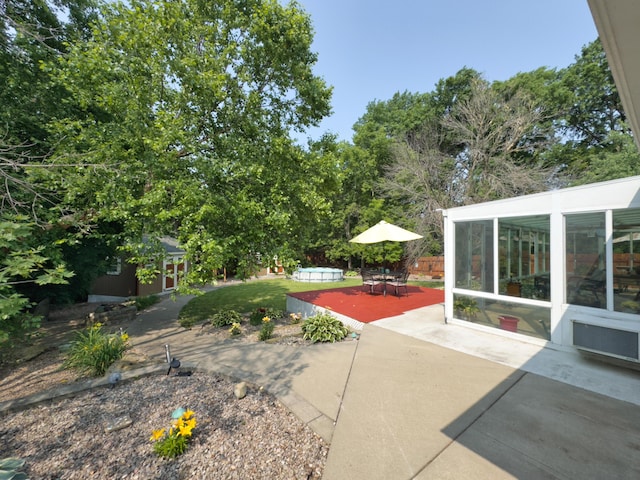 1402 Jean Rae Dr, Columbia, MO 65203 - view of yard featuring a sunroom and a patio