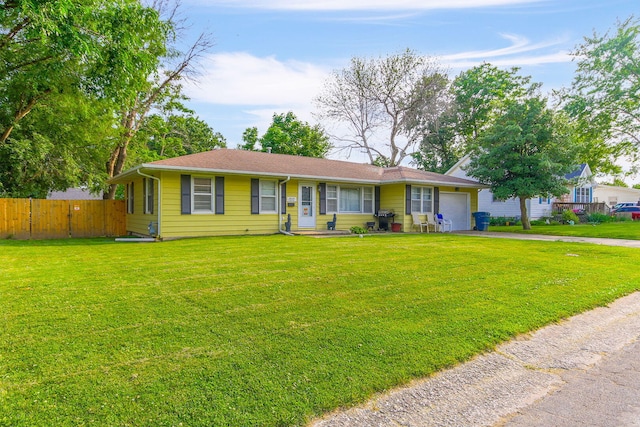 1212 Rosebud St, Mexico, MO 65265 - ranch-style home with a garage and asphalt driveway